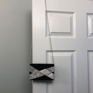 Black matte sateen clutch with rhinestone bow